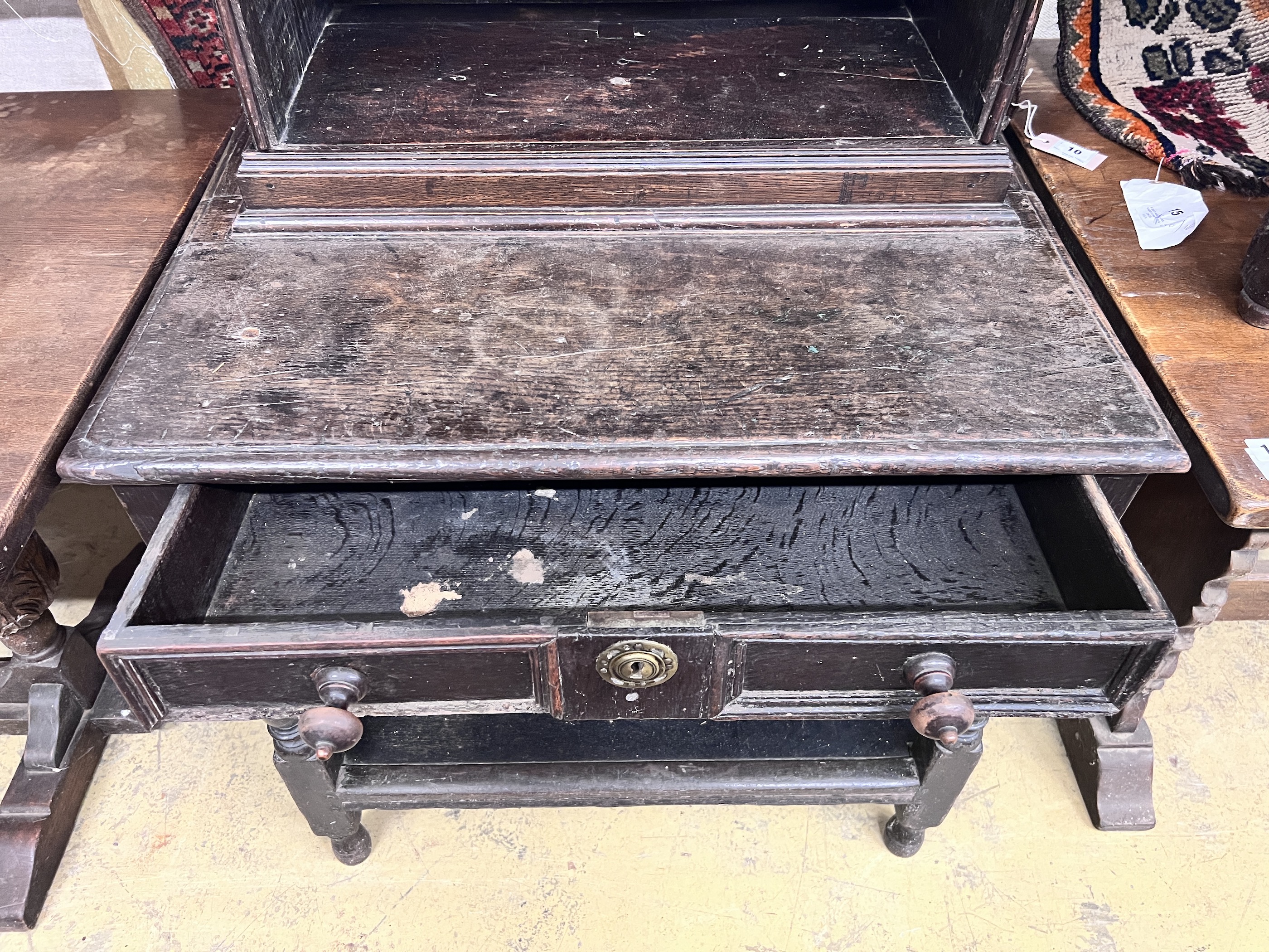 An 18th century style Flemish carved oak side cabinet, width 80cm, depth 62cm, height 165cm